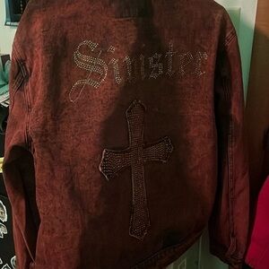 This is a vintage jacket with a back design with cross. Size large